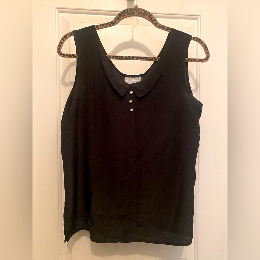 Sheer black tank with pearl faux button detail.